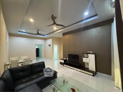 Spacious modern living room with elegant ceiling design and cozy seating area.