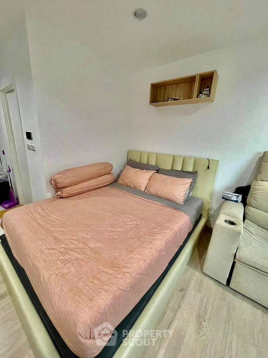 Cozy bedroom with modern decor and comfortable bed in a stylish apartment.