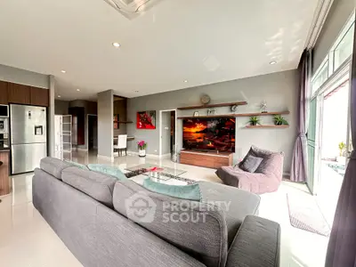 Spacious modern living room with large windows and stylish decor