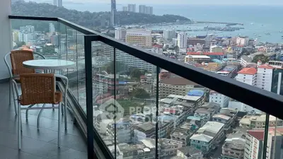 Stunning high-rise balcony with breathtaking city and ocean views, perfect for relaxation and entertainment.