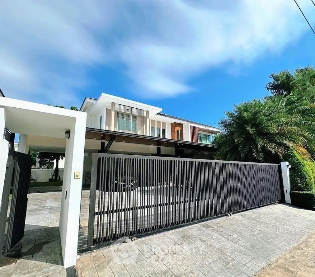 Stunning modern house with sleek design and spacious driveway, perfect for luxury living.