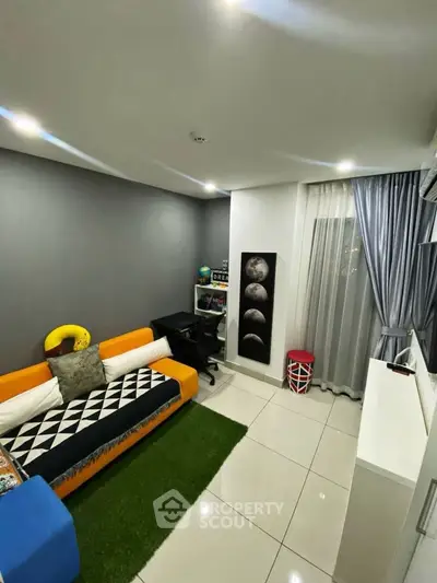 Modern living room with vibrant decor and sleek furnishings