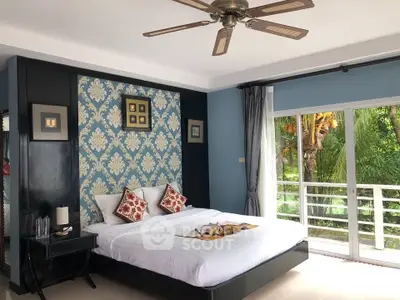 Luxurious bedroom with elegant decor and garden view, featuring a stylish ceiling fan and large windows.