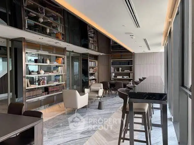 Luxurious modern library with elegant seating and floor-to-ceiling windows