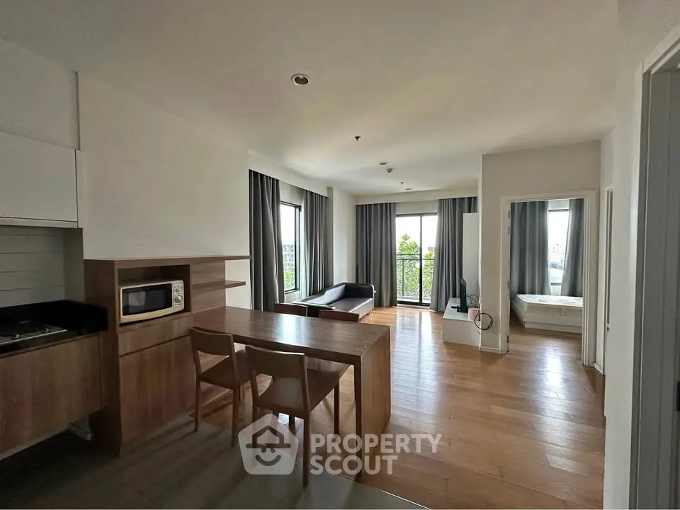Spacious modern apartment with open layout, featuring a cozy living area and stylish kitchen.