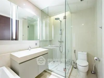 Modern bathroom with glass shower and sleek fixtures