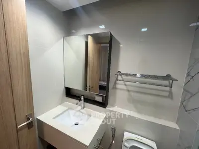 Modern bathroom with sleek design and large mirror