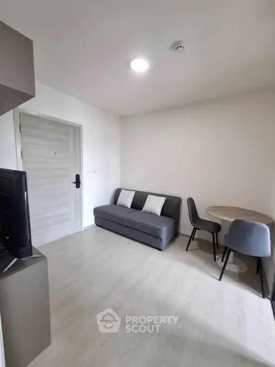 Modern living room with sleek furniture and minimalist design, perfect for urban living.