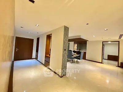 Spacious modern apartment interior with open layout and elegant dining area.