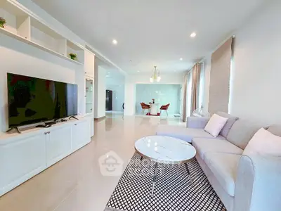 Spacious modern living room with elegant decor and open dining area