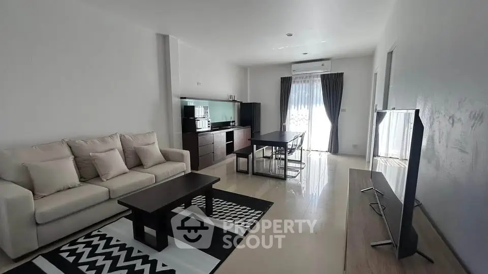 Spacious modern living room with sleek furniture and natural light