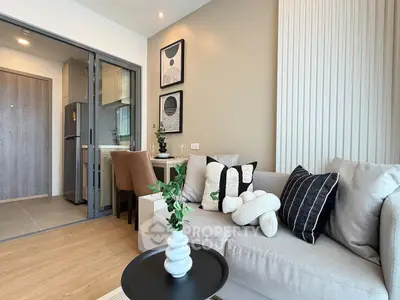 Modern living room with stylish decor and cozy seating in a contemporary apartment.