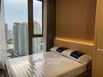Modern bedroom with stunning city view and stylish wooden paneling.