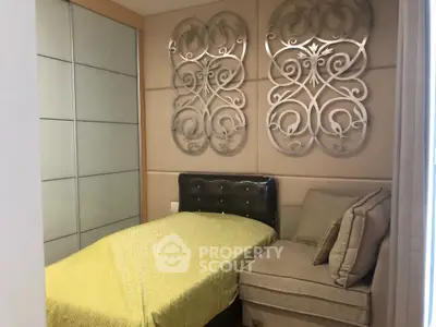 Luxurious small bedroom with elegant decor and cozy seating area