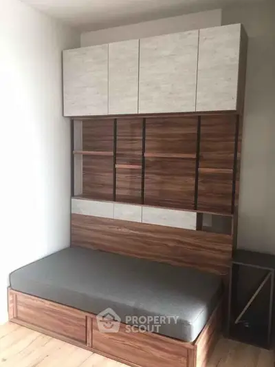 Modern compact bedroom with stylish wooden storage and sleek design