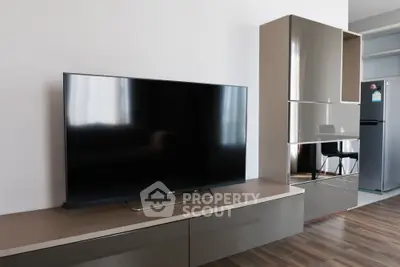 Modern living room with sleek TV and stylish storage cabinets