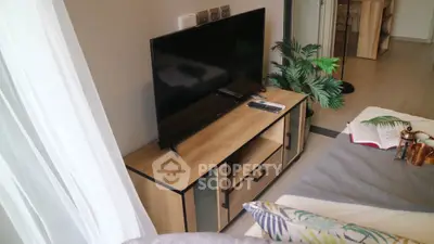 Modern living room with sleek TV stand and cozy decor