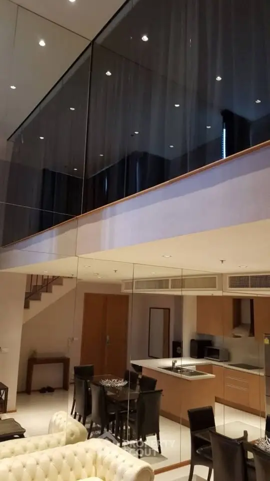 Luxurious modern duplex with open kitchen and elegant dining area