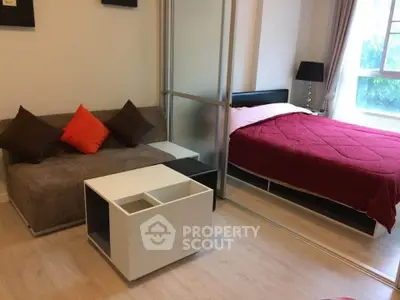 Cozy studio apartment with modern furnishings and natural light