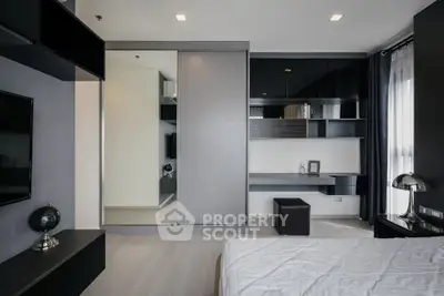 Modern bedroom with sleek design, built-in wardrobe, and stylish decor