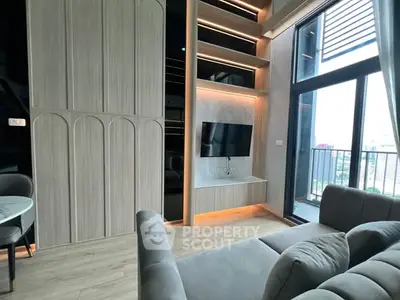 Modern living room with sleek design and balcony view