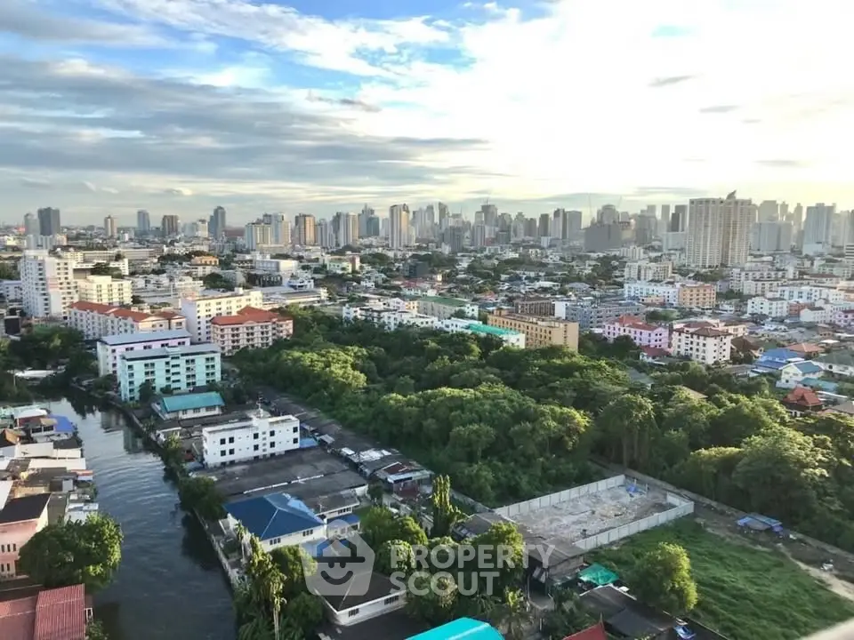 Stunning cityscape view with lush greenery and skyline in the background.