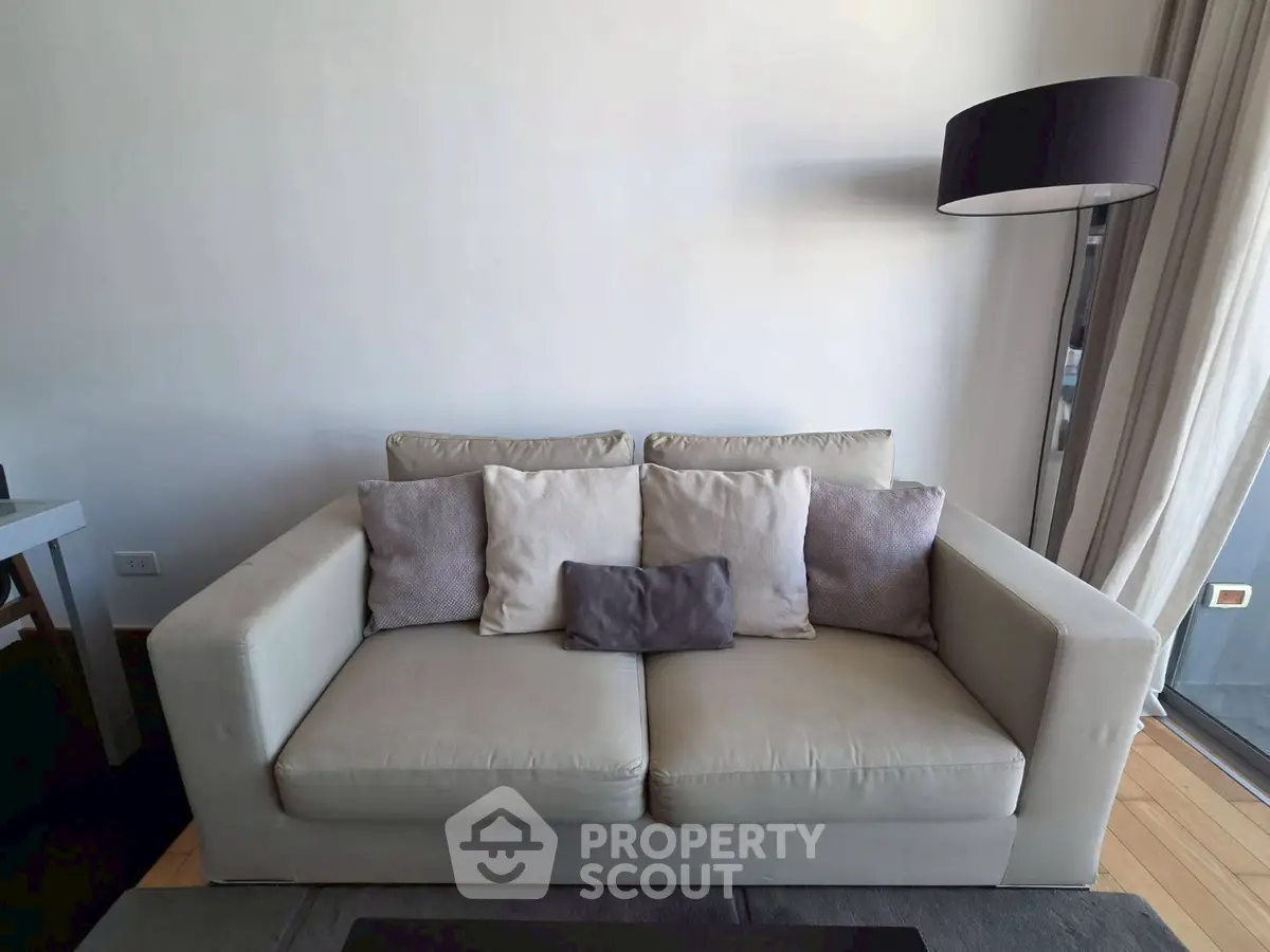 Modern living room with stylish sofa and floor lamp