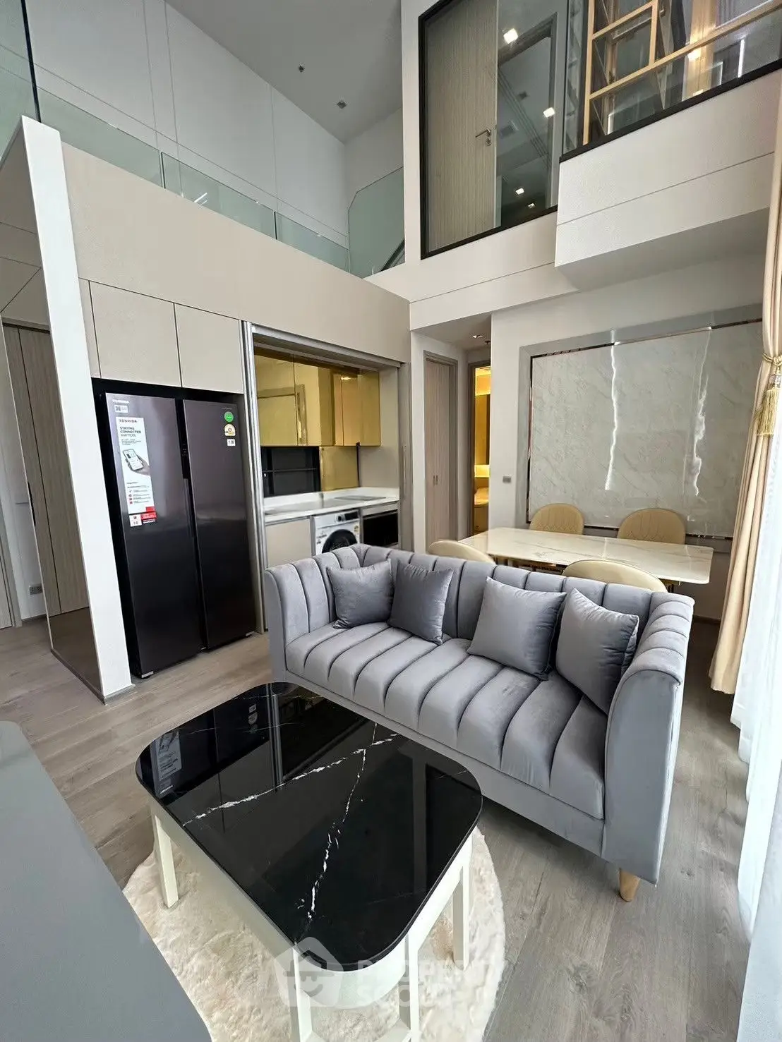 Modern duplex apartment with stylish living room and open kitchen layout