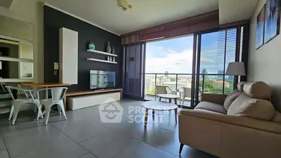 Modern living room with city view, sleek furniture, and natural light.