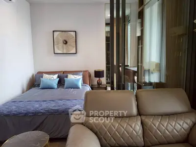 Modern bedroom with stylish decor and comfortable seating area