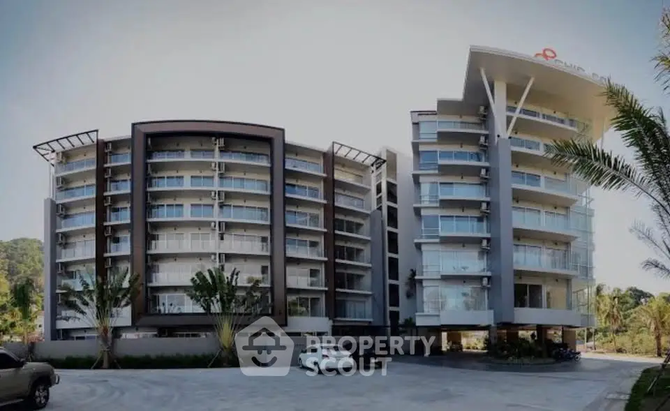 Modern apartment building with sleek design and spacious balconies in a prime location.