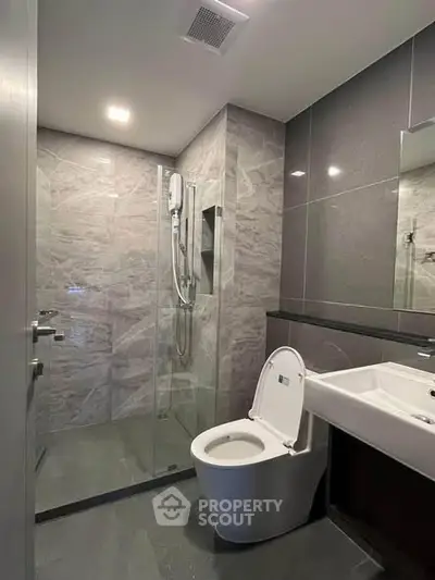 Modern bathroom with sleek design and glass shower enclosure