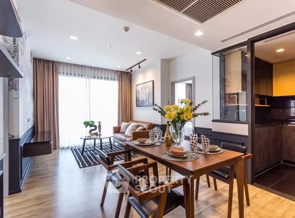 Modern open-plan living room with dining area and stylish kitchen