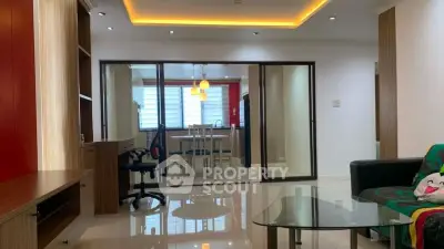 Spacious modern living room with glass partition and stylish lighting