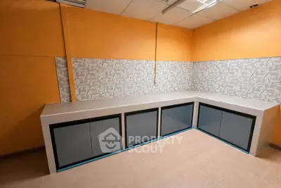 Spacious modern kitchen with sleek cabinetry and stylish backsplash