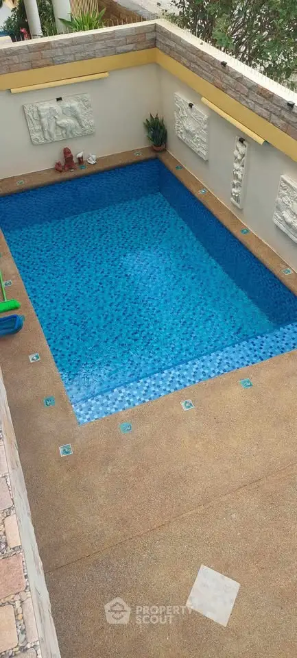 Luxurious private pool with elegant stone accents and serene ambiance.