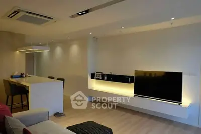 Modern living room with sleek TV setup and stylish lighting