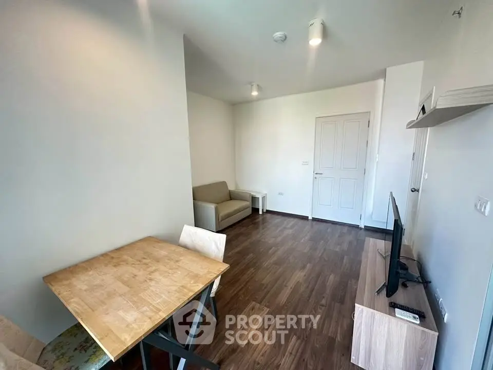 Modern living room with wooden flooring and minimalist furniture