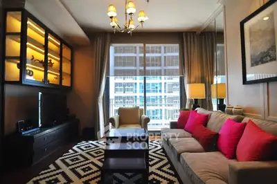 Luxurious living room with modern decor and large windows offering city views.
