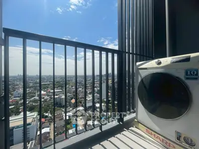 Stunning high-rise balcony view with cityscape and washing machine, perfect for urban living.