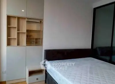 Modern bedroom with sleek built-in storage and minimalist design