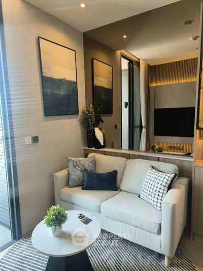 Modern living room with cozy sofa and stylish decor in a contemporary apartment.