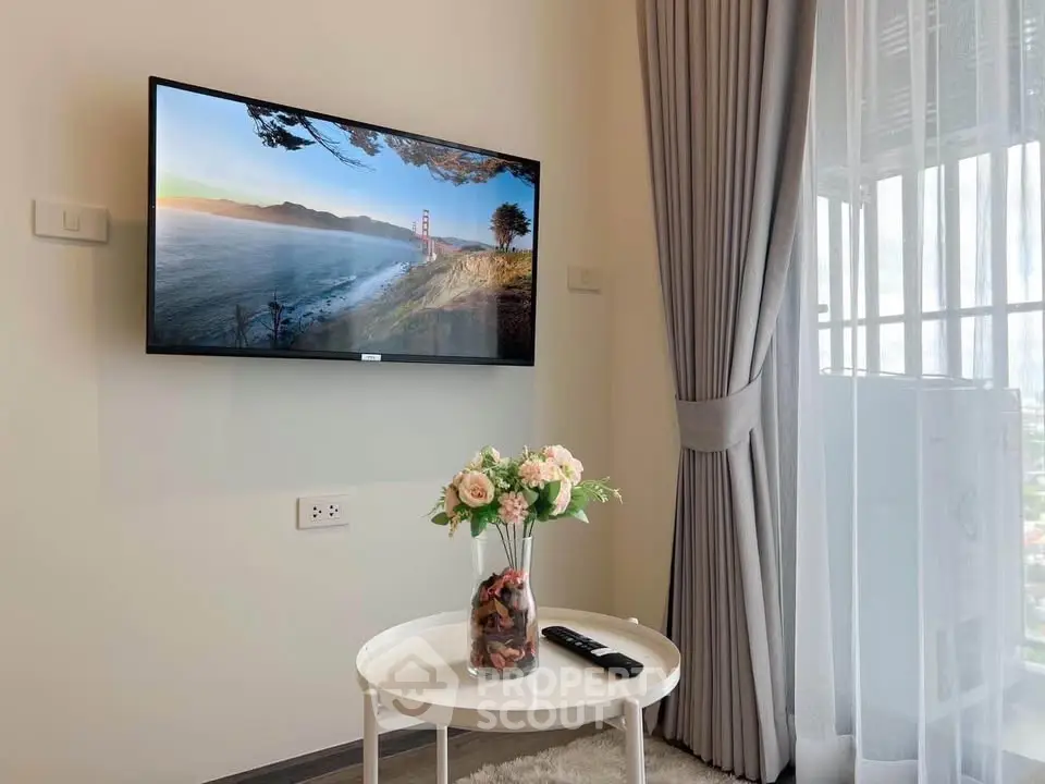 Modern living room with wall-mounted TV and elegant decor