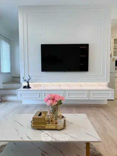 Elegant living room with modern TV setup and stylish decor