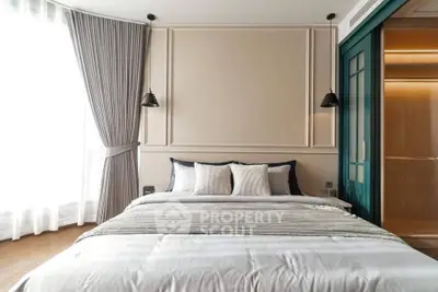 Luxurious bedroom with elegant decor and natural light, featuring plush bedding and stylish curtains.