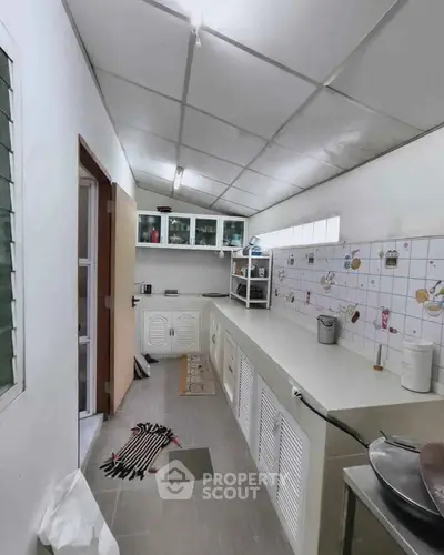 Spacious kitchen with ample storage and modern design