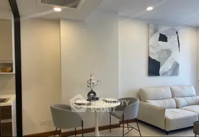 Modern living room with cozy seating and elegant decor