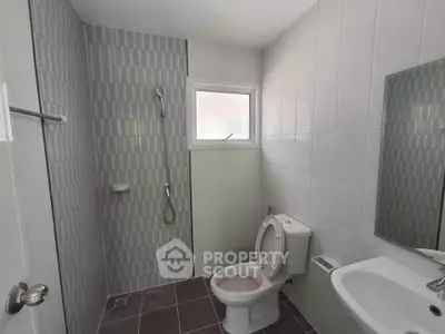 Modern bathroom with sleek tiles and contemporary fixtures
