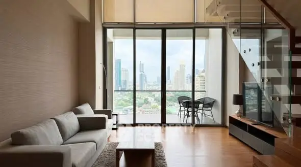 Spacious modern living room with city view and stylish decor