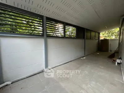 Spacious covered outdoor area with modern design and natural light